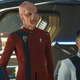 Stamets (Anthony Rapp), Saru (Doug Jones), and Culber (Wilson Cruz) wearing their Starfleet uniforms in a scene from Star Trek: Discovery.